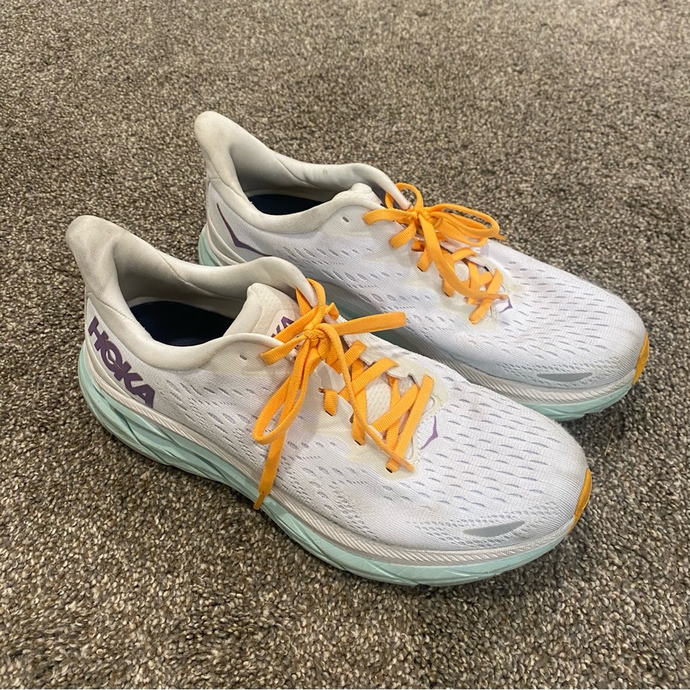 Hoka Women’s White Running Shoes with Mint Sole and Orange Laces
